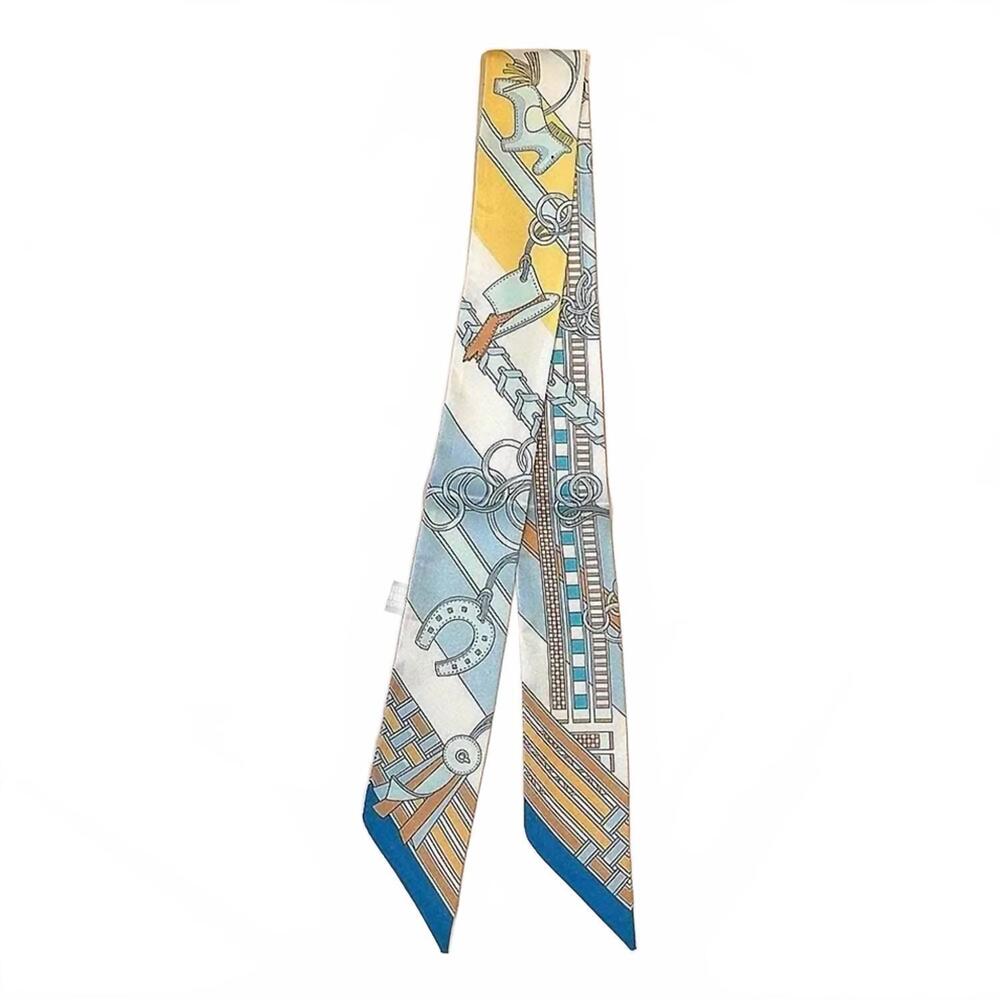 NEW SENSIBLING CORP women's chain & harness print silky skinny scarf in light bl